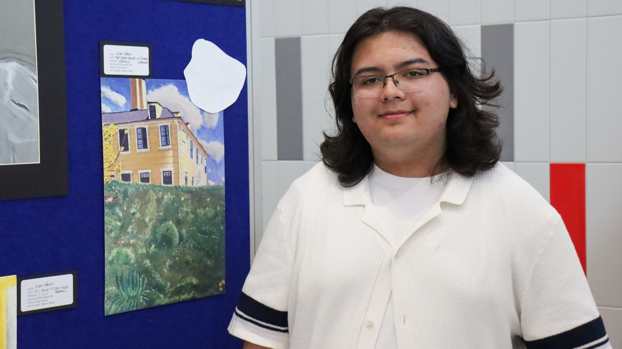 Nat Hem standing next to his painting of the Bellingham-Cary House that won the Congressional Art Competition